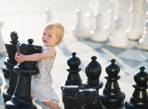 Baby playing in chess