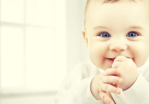 child, happiness and people concept – adorable baby