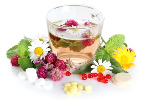 Herbal tea and pills isolated on a white background