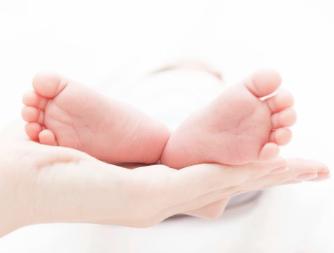 Baby feet in mothers hands