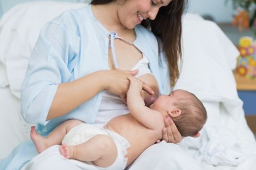 Mother breastfeeding a new born baby