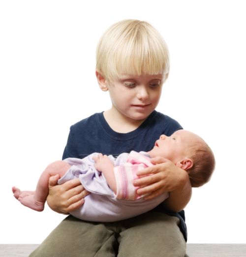 Toddler with newborn sister