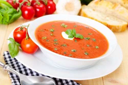 fresh tomato soup in a white bowl